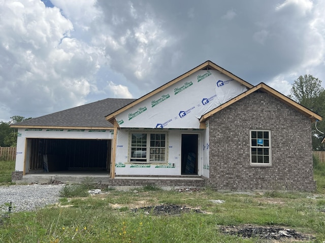 unfinished property with a garage