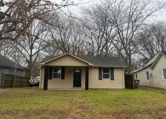 bungalow-style house with a front yard