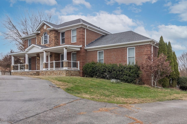 view of front facade with a porch and a front yard