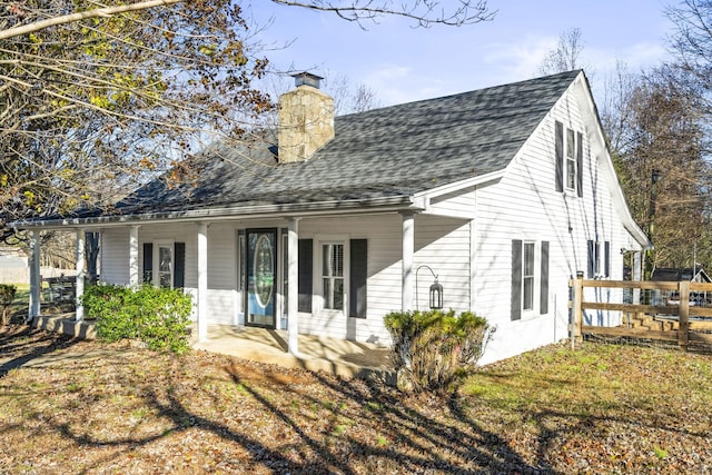 rear view of house with covered porch