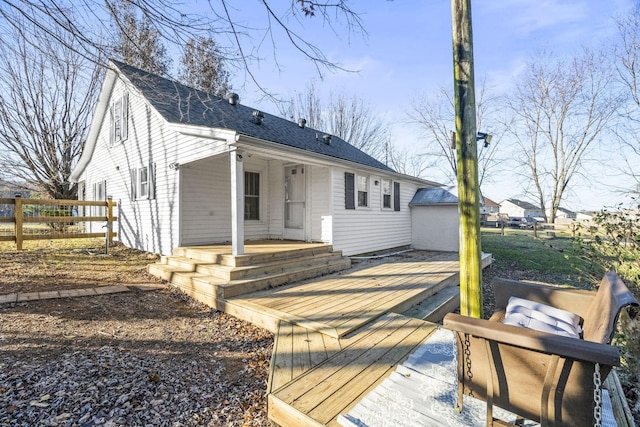 back of house featuring a deck