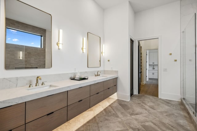 bathroom with a shower and vanity