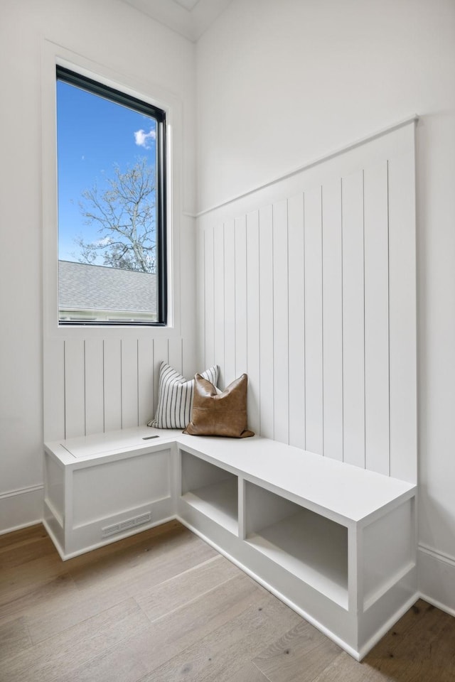 mudroom with light hardwood / wood-style flooring