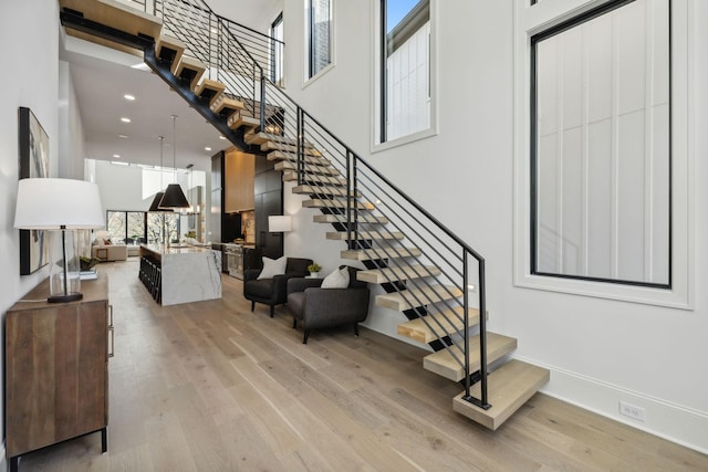 stairway with hardwood / wood-style floors