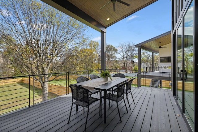 wooden terrace featuring ceiling fan