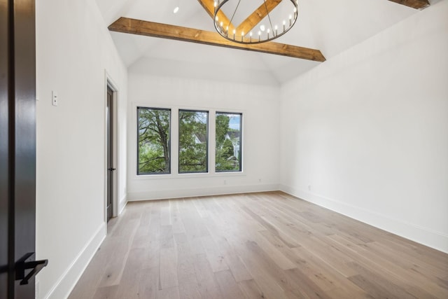 spare room featuring beamed ceiling, high vaulted ceiling, light hardwood / wood-style flooring, and an inviting chandelier