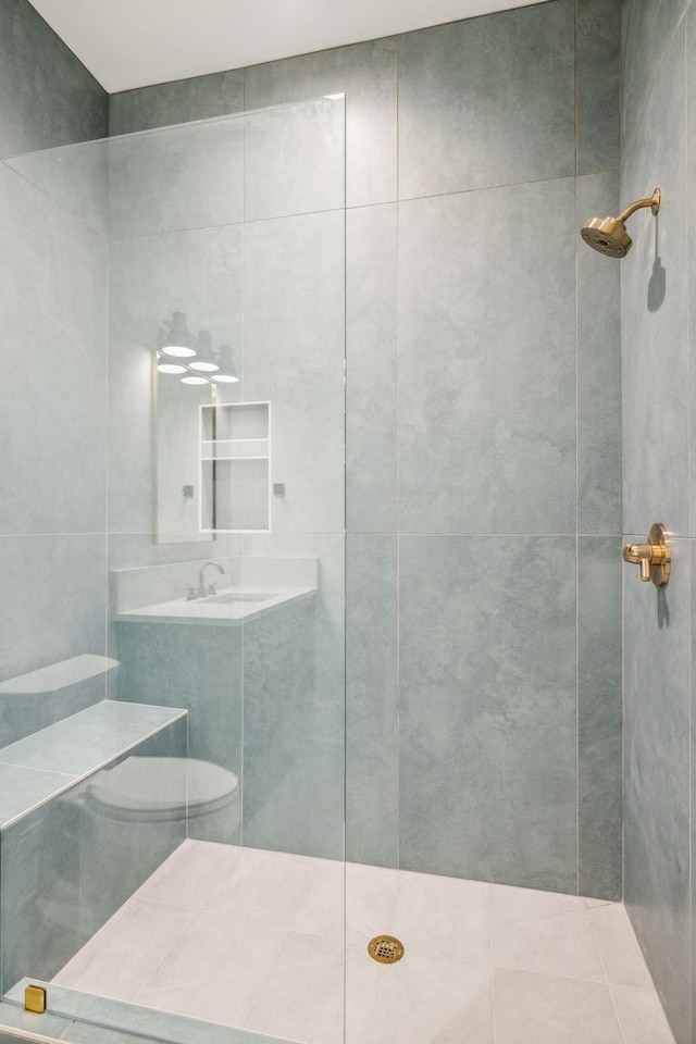 bathroom featuring a shower and sink