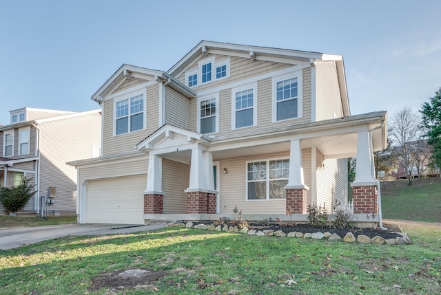 view of front of house featuring a porch, a garage, and a front lawn