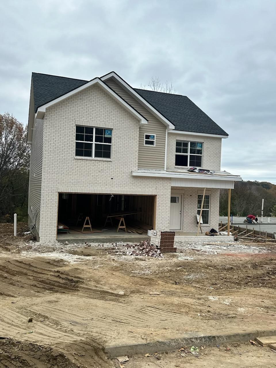 view of front of property featuring a porch and a garage