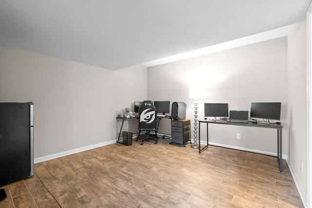 office area with light wood-type flooring