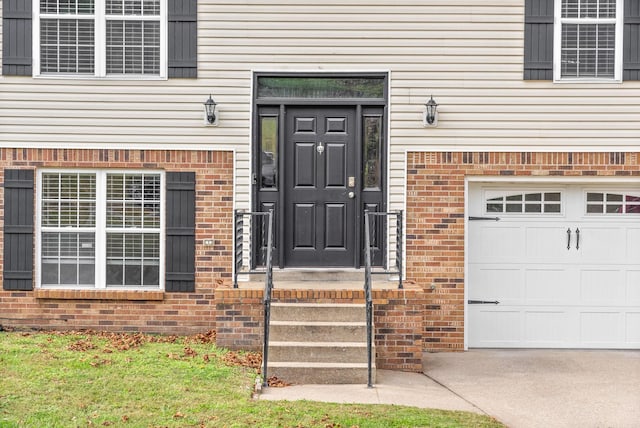 entrance to property featuring a garage