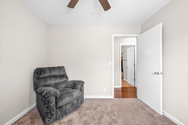 sitting room with carpet floors and ceiling fan