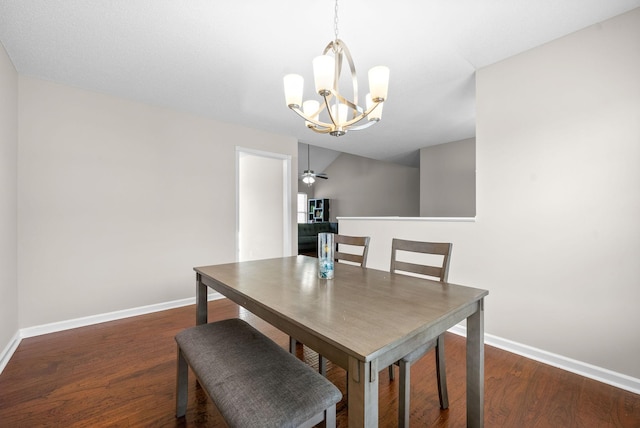 dining area featuring ceiling fan with notable chandelier and dark hardwood / wood-style flooring