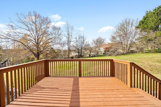 wooden deck with a lawn