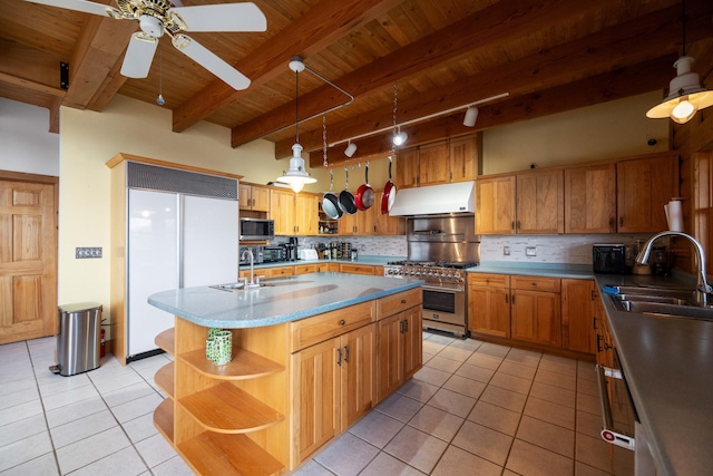 kitchen with high quality appliances, sink, light tile patterned floors, tasteful backsplash, and beamed ceiling