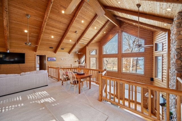 dining space with beam ceiling, high vaulted ceiling, ceiling fan, and wooden ceiling