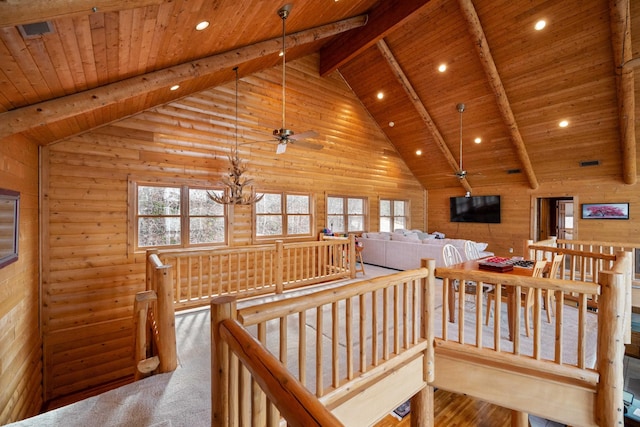 interior space featuring a notable chandelier, wooden ceiling, and high vaulted ceiling