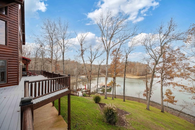 view of yard featuring a deck with water view