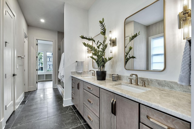 bathroom featuring vanity and a healthy amount of sunlight