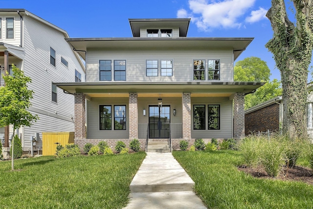 view of front of house with covered porch and a front yard