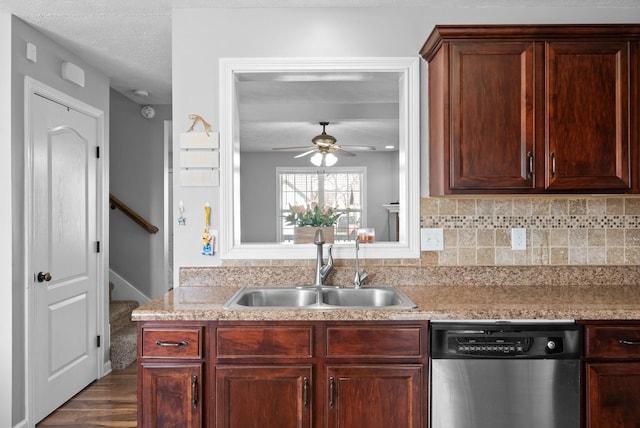 kitchen with ceiling fan, decorative backsplash, dark hardwood / wood-style floors, sink, and stainless steel dishwasher