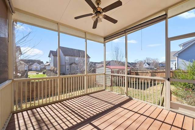 sunroom / solarium featuring ceiling fan