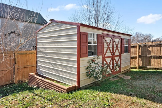 view of outbuilding with a yard