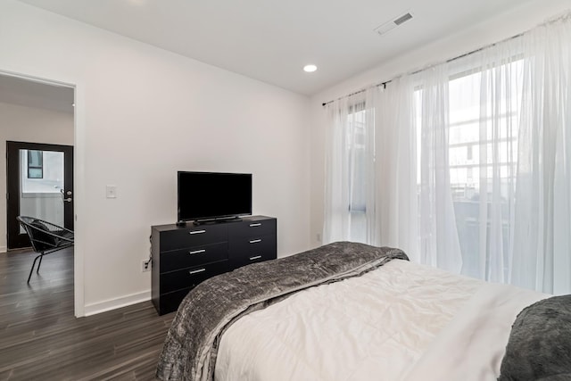 bedroom featuring dark hardwood / wood-style floors