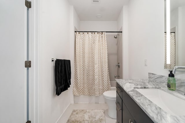 full bathroom with tile patterned flooring, vanity, shower / tub combo, and toilet