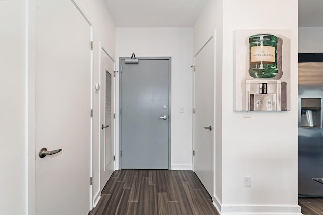 hallway with dark hardwood / wood-style floors