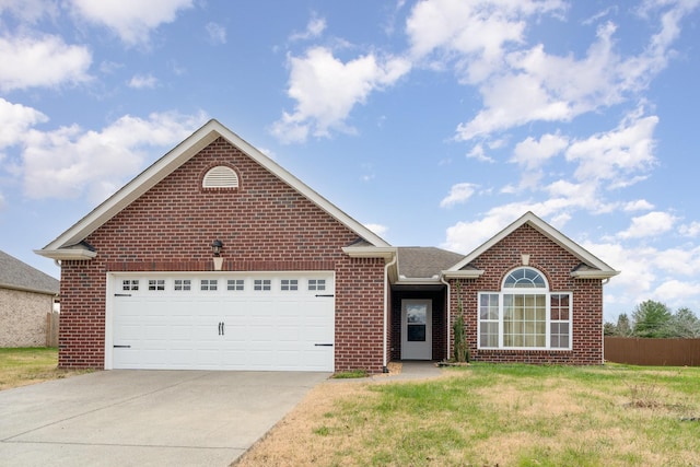 view of front of house featuring a garage and a front yard