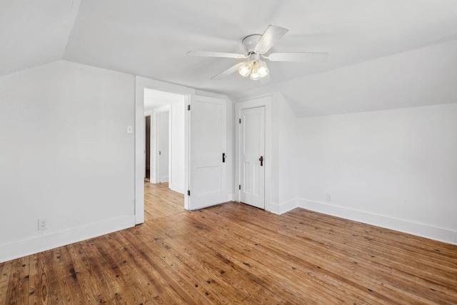 additional living space featuring light hardwood / wood-style floors, ceiling fan, and lofted ceiling