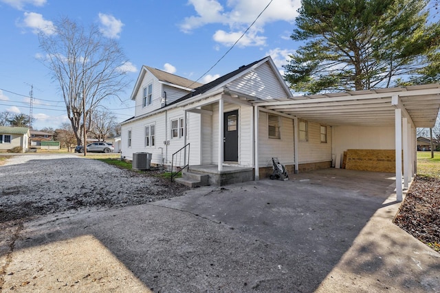 view of home's exterior with a carport and cooling unit