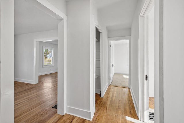 hall with light wood-type flooring