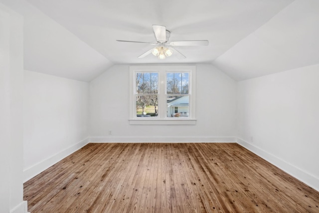 bonus room with wood-type flooring, ceiling fan, and lofted ceiling