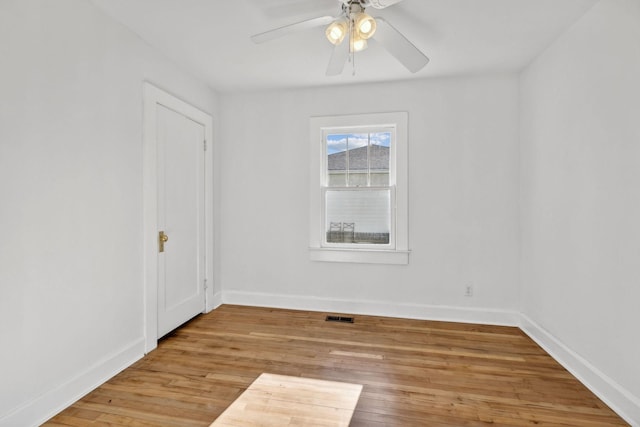 unfurnished room featuring ceiling fan and light hardwood / wood-style flooring