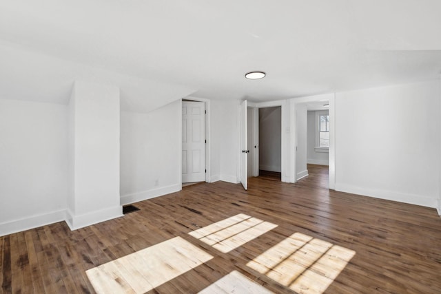 spare room featuring dark hardwood / wood-style flooring