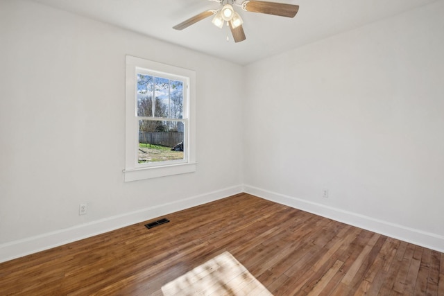 empty room featuring wood-type flooring and ceiling fan