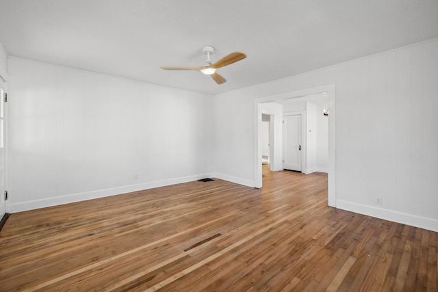 spare room with ceiling fan and hardwood / wood-style flooring