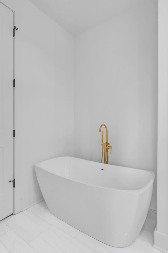 bathroom featuring a tub to relax in