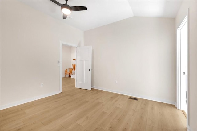 unfurnished bedroom with ceiling fan, light hardwood / wood-style flooring, and lofted ceiling