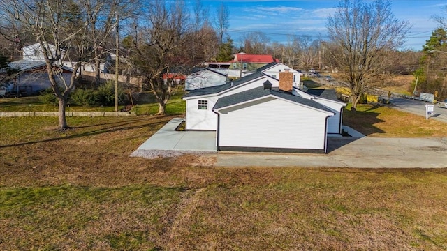 view of storm shelter with a yard