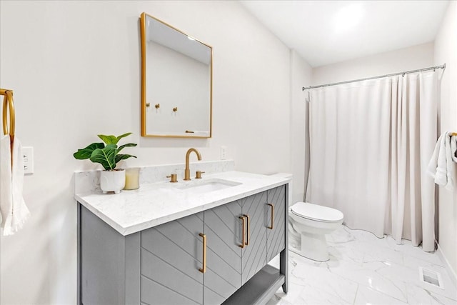 bathroom with vanity, toilet, and a shower with curtain