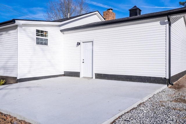 view of side of home with a patio