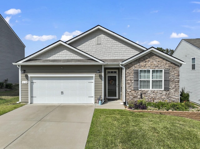 craftsman house with a front yard and a garage