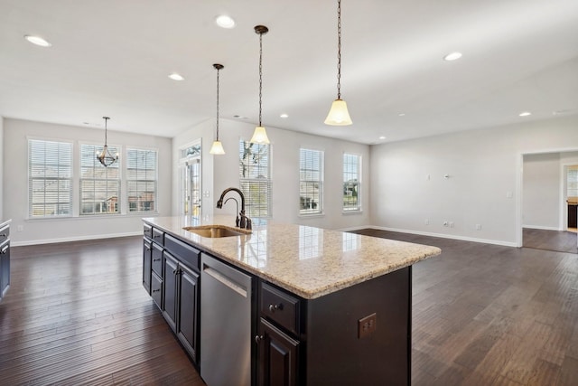 kitchen with a center island with sink, dishwasher, plenty of natural light, and sink