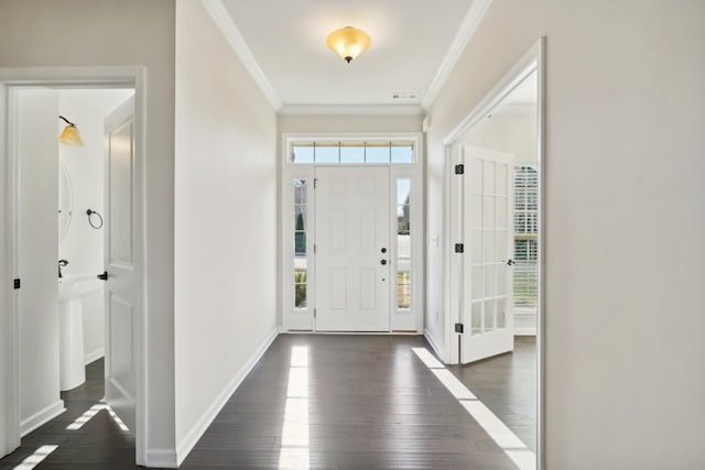 entryway with crown molding and dark wood-type flooring