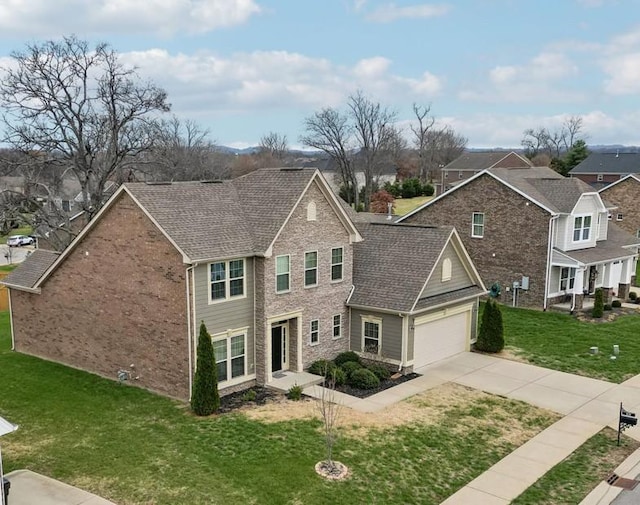 view of front facade featuring a garage and a front lawn