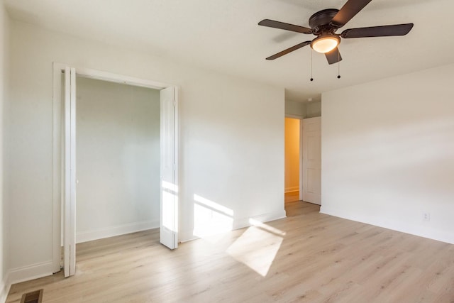 unfurnished room featuring ceiling fan and light hardwood / wood-style floors