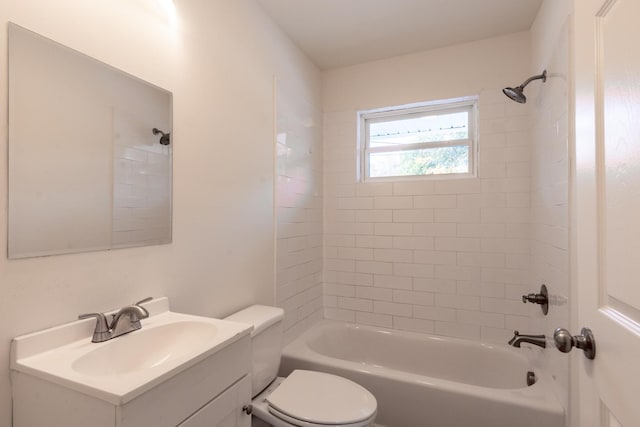 full bathroom with tiled shower / bath combo, toilet, and vanity